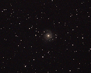 Click to view larger astrophoto. M74 Wide