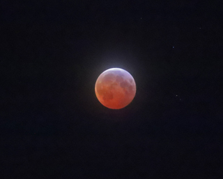 Click to view larger astrophoto. Cloudy Bloodmoon